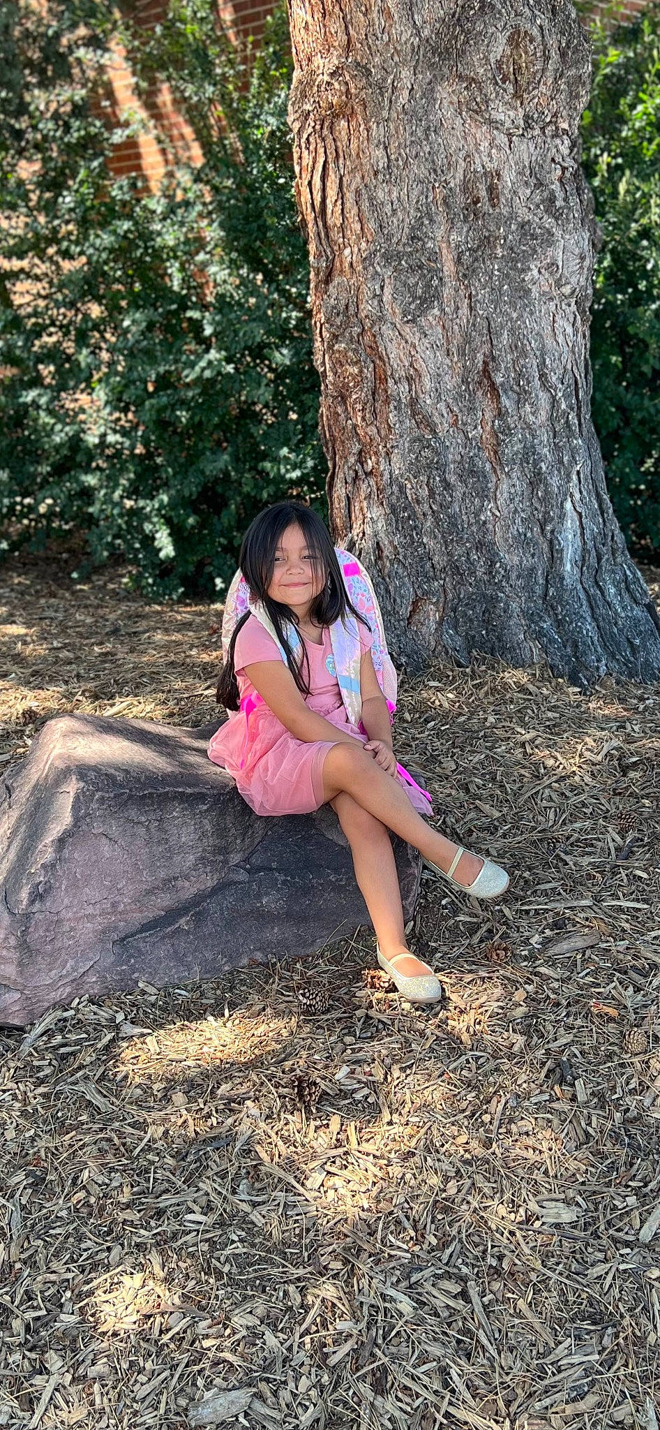 Aurora is registered to the contest to win money with this photo: black_hair, branch, deciduous, eyewear, fawn, forest, fun, grass, joy, knee, leisure, long_hair, people_in_nature, person, plant, thigh, tints_and_shades, tree, trunk, wood