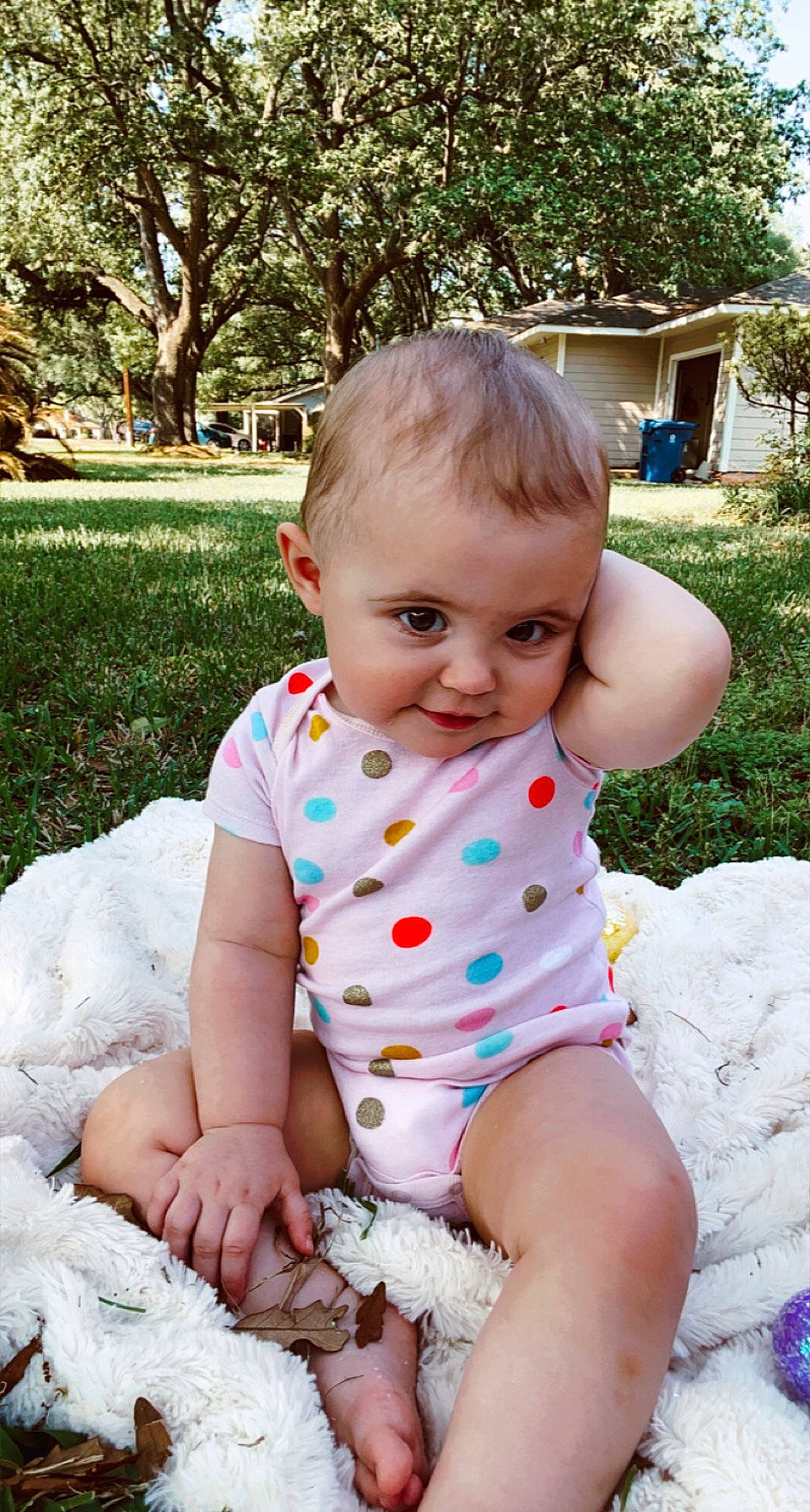 Blayne is registered to the contest to win money with this photo: baby, baby_toddler_clothing, cheek, child, dress, fun, grass, happy, iris, leaf, pattern, person, photograph, pink, plant, skin, sleeve, smile, summer, toddler