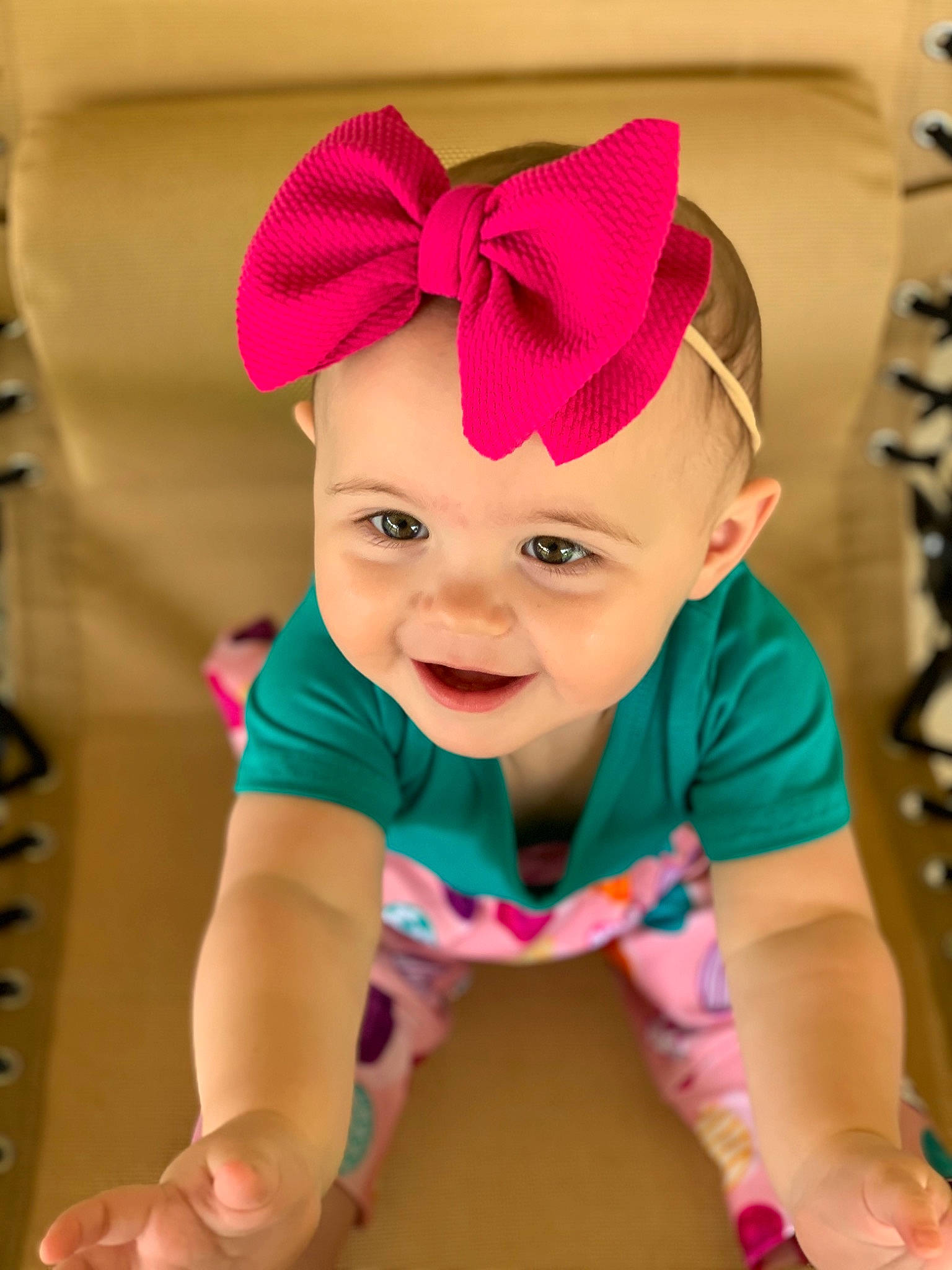 Blayne is registered to the contest to win money with this photo: baby, baby_toddler_clothing, cap, cheek, child, chin, clothing, eye, fashion_accessory, fun, happy, headband, headgear, joy, magenta, pattern, person, pink, sleeve, smile