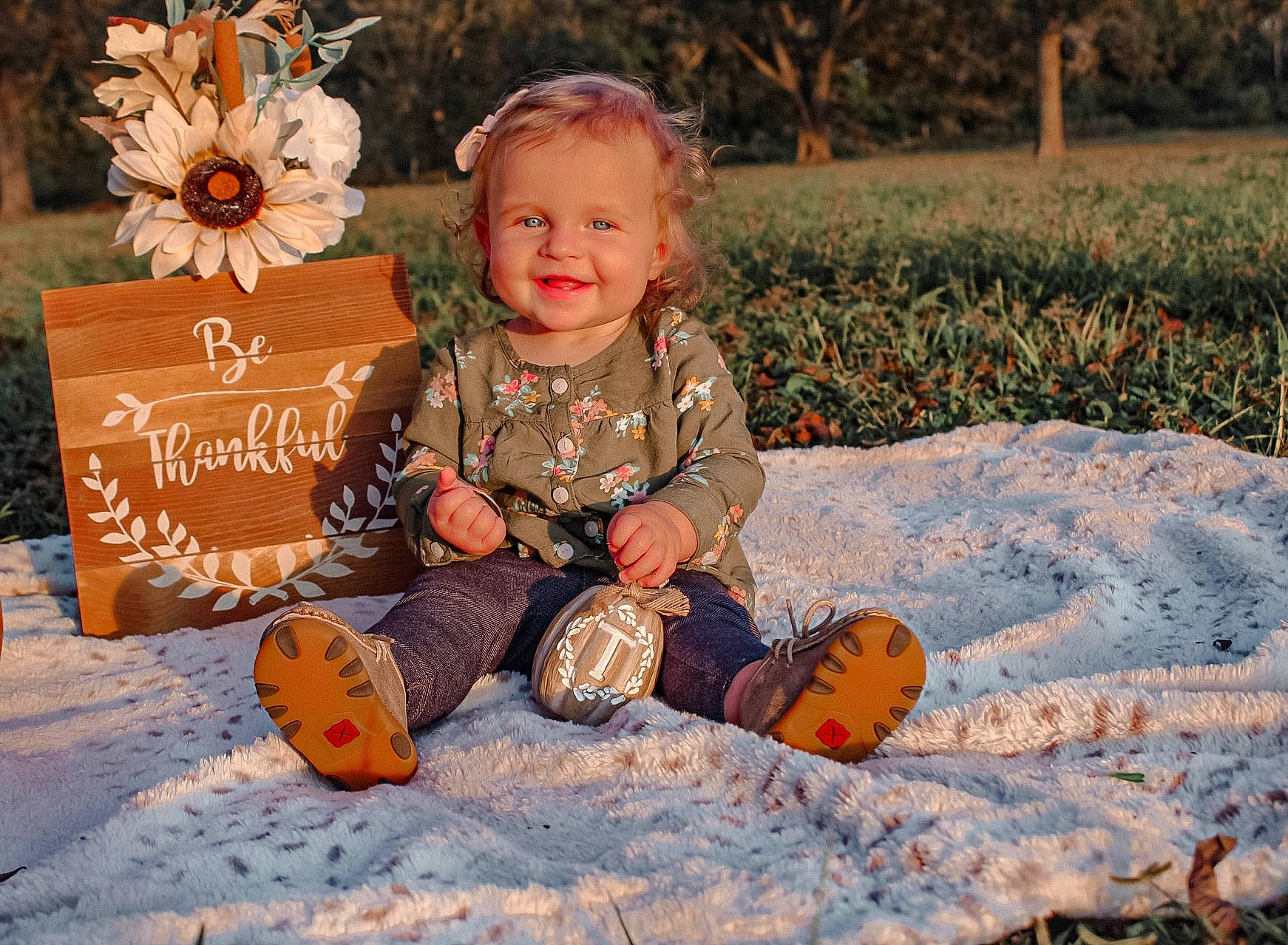 Sadie joined the competition — help win amazing prizes! baby, baby_toddler_clothing, child, eye, face, flower, grass, happy, head, joy, leaf, morning, orange, people_in_nature, person, plant, playing_with_kids, pumpkin, smile, snow
