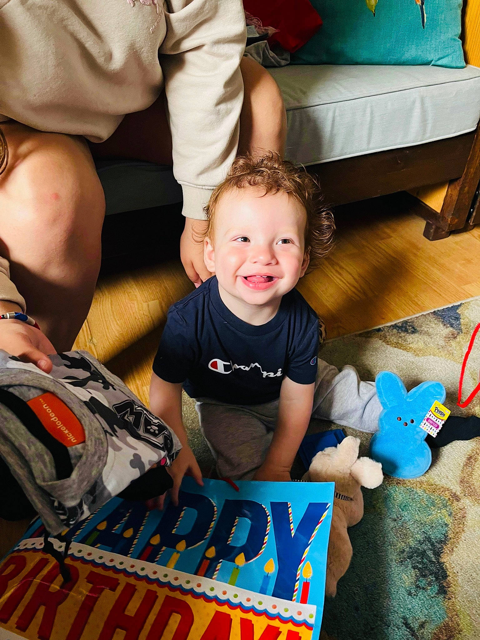 Elliot is registered to the contest to win money with this photo: arm, baby, baby_toddler_clothing, blue, child, event, fun, hairstyle, happy, human_body, joy, leisure, people, person, product, shorts, sitting, smile, t_shirt, toddler