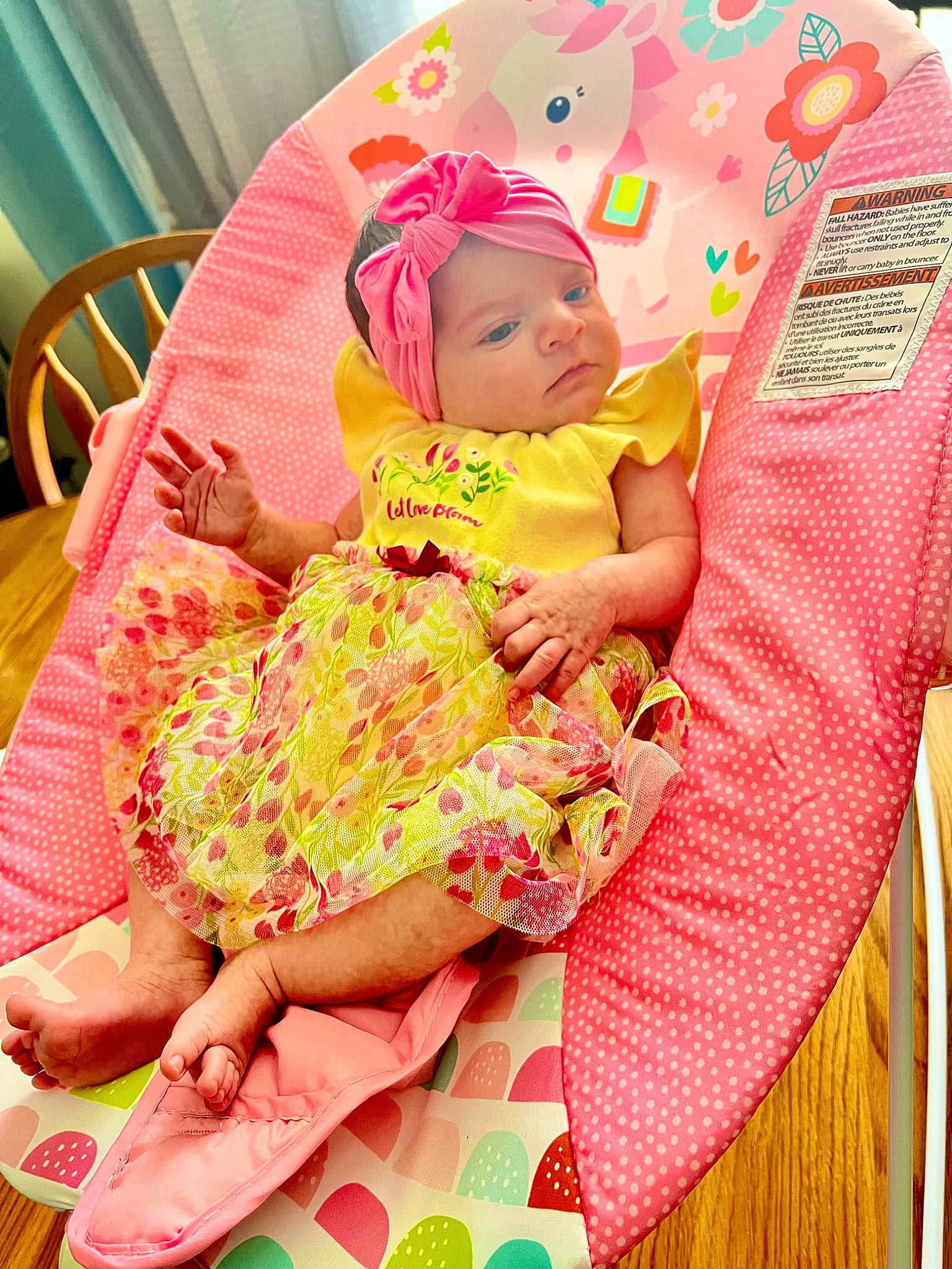 Juliette is registered to the contest to win money with this photo: baby, baby_products, baby_toddler_clothing, child, comfort, green, happy, headwear, lap, linens, magenta, pattern, peach, person, pink, product, room, sitting, skin, textile