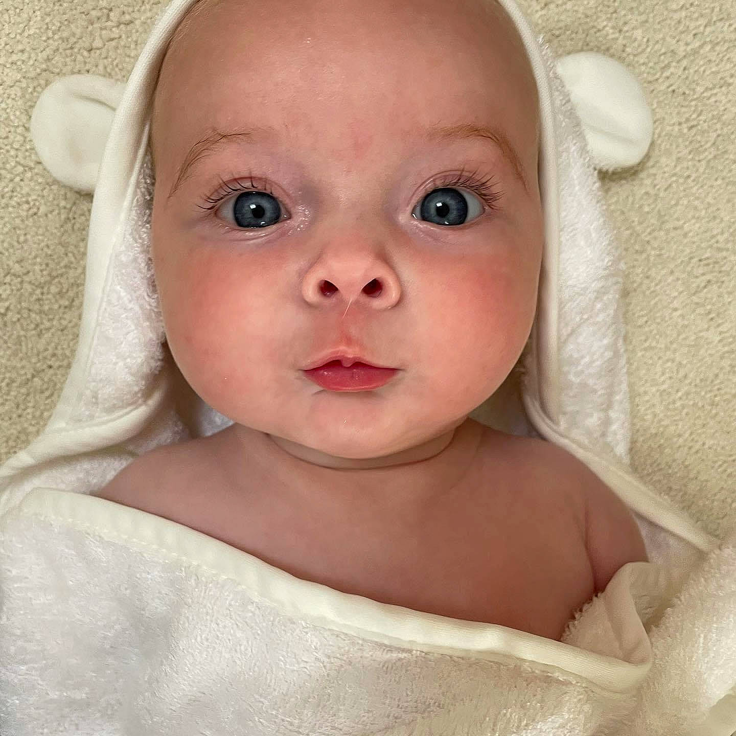 Amelie is registered to the contest to win money with this photo: baby, baby_toddler_clothing, cheek, chin, dress, ear, eye, eyebrow, eyelash, hair, happy, human_body, iris, lip, neck, no_expression, nose, person, skin, sleeve