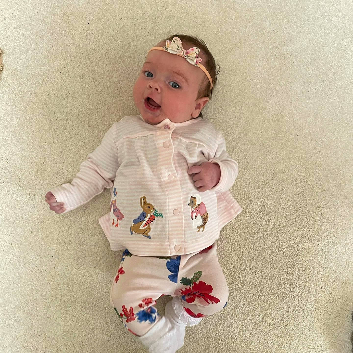 Amelie joined the competition — help win amazing prizes! baby, baby_products, baby_toddler_clothing, baby_toys, carmine, costume, costume_hat, doll, fashion_accessory, fictional_character, finger, hand, happy, head, pattern, person, sitting, sleeve, smile, toddler