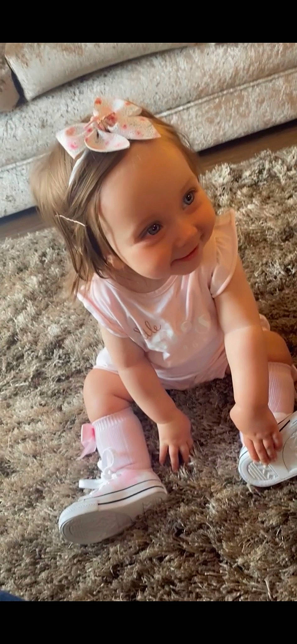 Maddison joined the competition — help win amazing prizes! baby, baby_toddler_clothing, blond, child, eye, face, finger, fun, grass, happy, head, headband, human_leg, people_in_nature, person, pink, skin, sneakers, soil, toddler