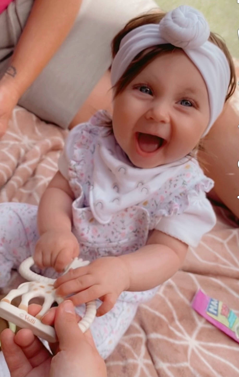 Maddison joined the competition — help win amazing prizes! baby, baby_toddler_clothing, cheek, child, comfort, finger, happy, headwear, iris, linens, pattern, people, person, pink, skin, sleeve, smile, textile, thigh, thumb