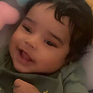 Blaze joined the competition — help win amazing prizes! baby, child, smiling, curly_hair, toy, blue_whale, green_shirt, cute, indoor, closeup, infant, happy, face, skin, hand, soft_toy, playful, young_child, portrait, comfort