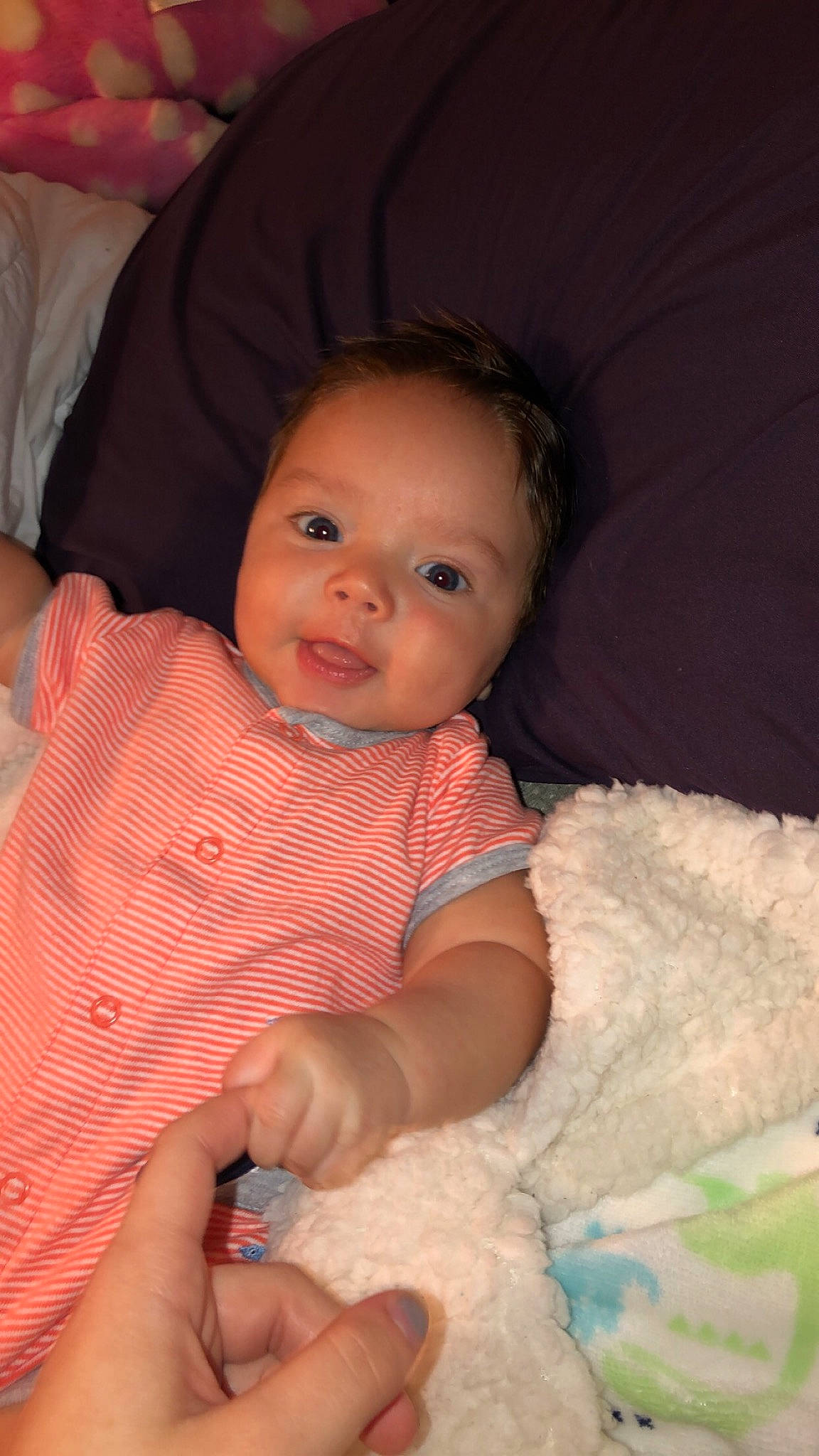 Liam joined the competition — help win amazing prizes! baby, beauty, cheek, child, chin, eye, face, finger, hand, head, iris, lip, mouth, nose, person, pink, sitting, skin, smile, textile