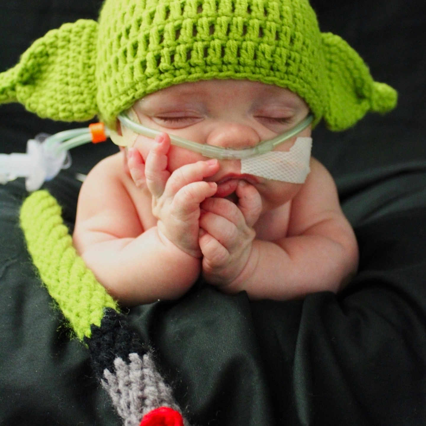 Jace joined the competition — help win amazing prizes! baby, baby_toddler_clothing, cap, eye, finger, gesture, grass, hand, hat, head, headgear, human_body, knit_cap, nail, plant, textile, thumb, toddler, wool, woolen