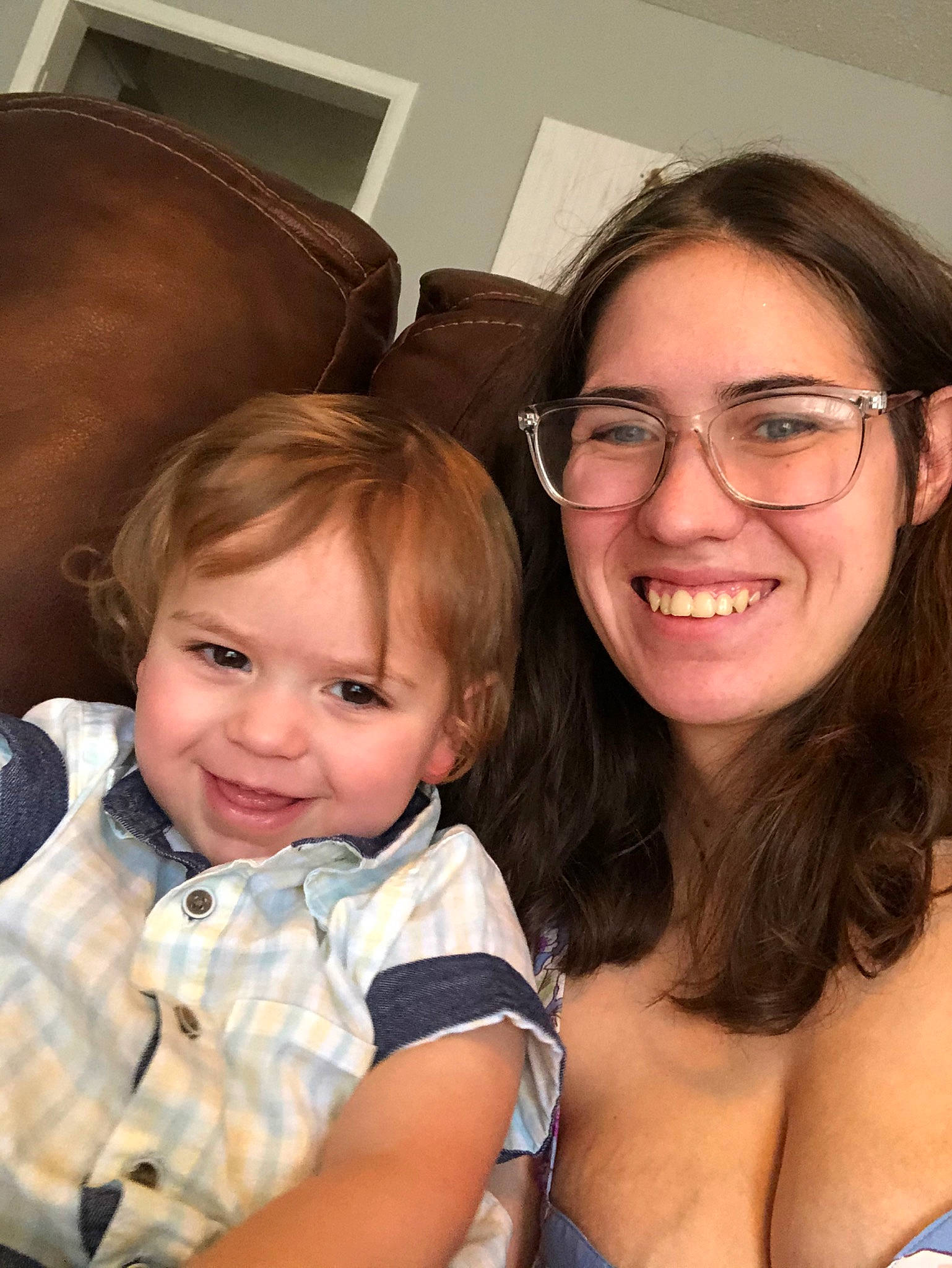 Hollis is registered to the contest to win money with this photo: baby, brown_hair, cheek, child, ear, eye, eyewear, face, fun, glasses, happy, iris, joy, people, person, sibling, sitting, skin, smile, toddler
