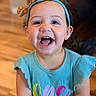 toddler, child, smiling, happy, headband, bow, clothing, blue, portrait, indoors, floor, face, teeth, person, baby, cute, celebration, birthday, young_child, ribbed_fabric