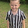 child, boy, smiling, outdoor, grass, striped_shirt, short_sleeve, portrait, happy, young, fashion, hairstyle, casual, person, nature, daylight, greenery, cute, standing, background_blur