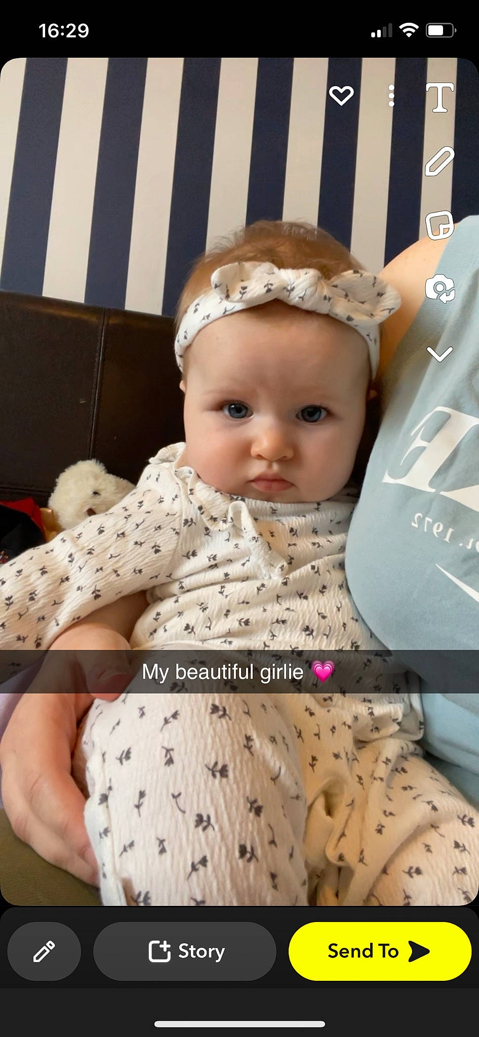 Evelyn joined the competition — help win amazing prizes! baby, baby_toddler_clothing, cap, child, costume_hat, design, eyelash, fashion_accessory, font, happy, headband, headpiece, headwear, jewellery, linens, pattern, person, photo_caption, sitting, sleeve