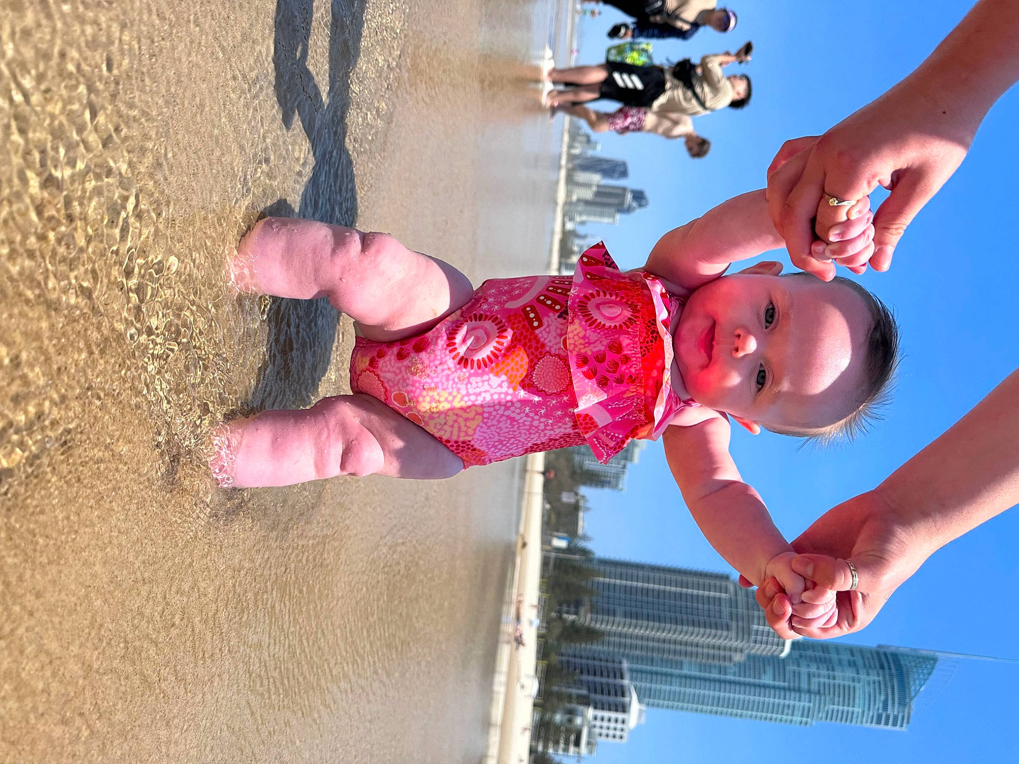 Lilianna joined the competition — help win amazing prizes! baby, baby_toddler_clothing, beach, child, elbow, finger, fun, gesture, hand, happy, leisure, person, photograph, sky, smile, snapshot, summer, toddler, vacation, water
