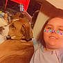 Lizzy is registered to the contest to win money with this photo: dog, person, selfie, mirror, butterfly_filter, brown_dog, indoor, smiling, phone, reflection, casual_clothing, bed, blanket, pet, closeup, head_and_shoulders, relaxed, home, comfort, companion
