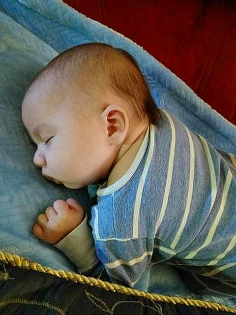 Juan is registered to the contest to win money with this photo: baby, baby_products, baby_sleeping, baby_toddler_clothing, bedtime, cheek, child, comfort, grass, iris, linens, nap, pattern, person, room, sitting, skin, sleep, sleeve, toddler