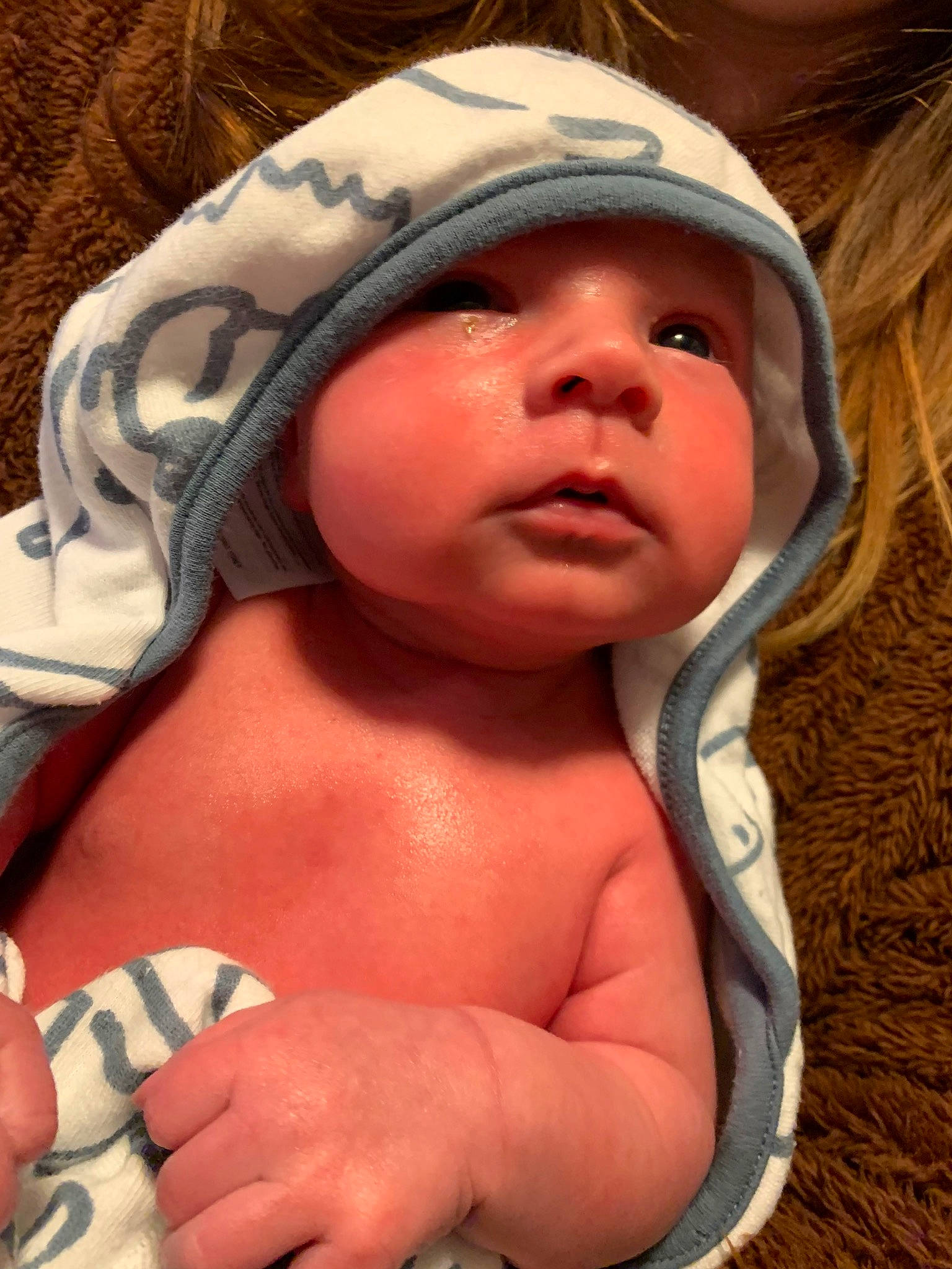 Colin is registered to the contest to win money with this photo: baby, cap, cheek, chest, chin, comfort, eye, eyebrow, eyelash, finger, happy, human, human_body, lip, mouth, neck, nose, person, skin, textile