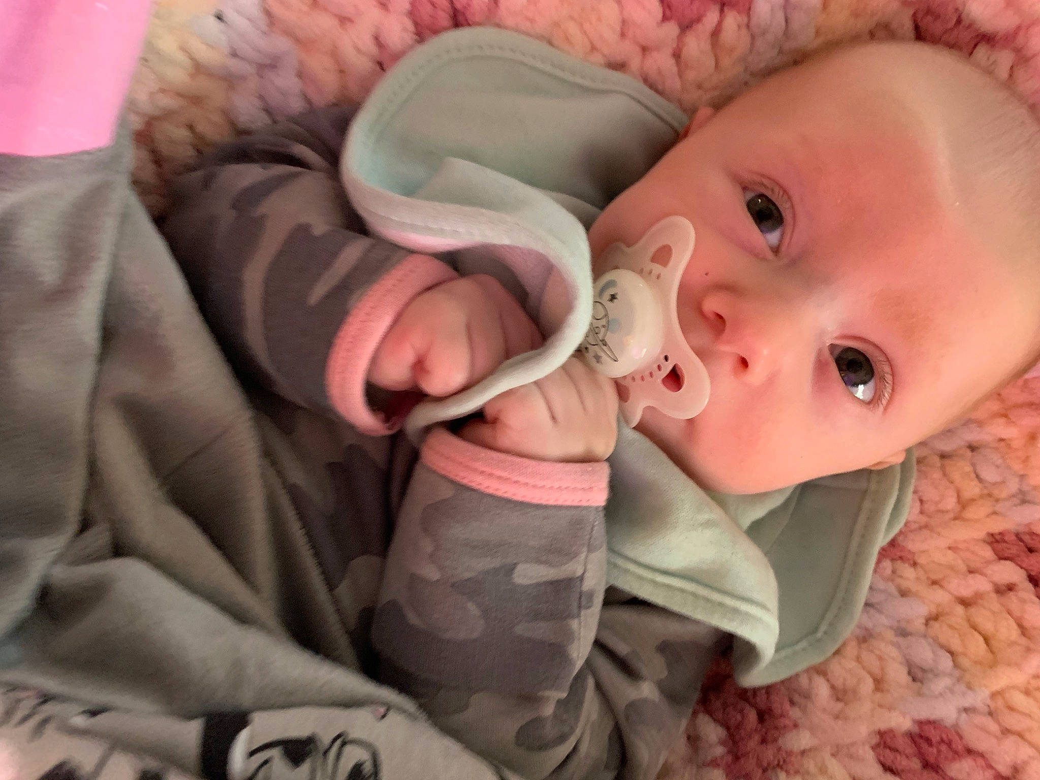 Magnolia is registered to the contest to win money with this photo: baby, baby_products, baby_toddler_clothing, carmine, cheek, child, comfort, ear, eyelash, fashion_accessory, gesture, happy, iris, linens, person, pink, product, skin, sleeve, textile