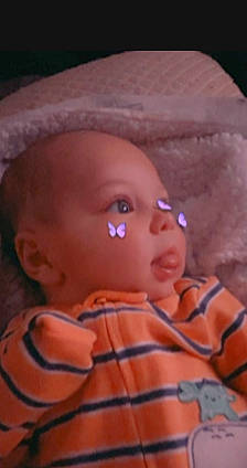 Anthony is registered to the contest to win money with this photo: baby, baby_toddler_clothing, cheek, child, comfort, electric_blue, eye, eyebrow, eyelash, fun, iris, magenta, mouth, nose, pattern, person, pink, room, skin, sleeve