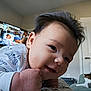 Noah is registered to the contest to win money with this photo: animal, baby, bodypart, cat, clothing, face, finger, hair, hand, happy, hat, head, indoors, mouth, person, pet, photography, portrait, smile, teeth
