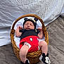 Eden participe au concours pour gagner de l'argent avec cette photo : baby, newborn, sleeping, basket, mickey_mouse, hat, booties, blanket, wicker, clothing, diaper, indoor, soft_texture, fur_rug, white_background, cute, infant, child, person, resting