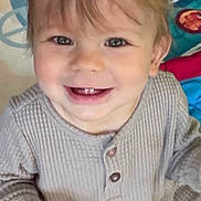 Raiden joined the competition — help win amazing prizes! baby, child, smiling, happy, toddler, indoor, playmat, clothing, face, person, cute, portrait, sitting, hair, eyes, buttoned_shirt, cozy, light, infant, hands