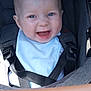 baby, smiling, blue_eyes, stroller, car_seat, straps, infant, happy, child, clothing, face, seatbelt, cute, portrait, baby_bib, safety, closeup, skin, head, expression