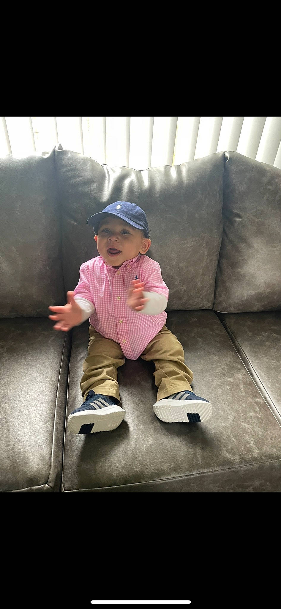Donovan joined the competition — help win amazing prizes! baby_toddler_clothing, boot, cap, child, comfort, couch, flash_photography, flooring, fun, grass, headwear, leisure, magenta, person, play, purple, recreation, shoe, sitting, sleeve