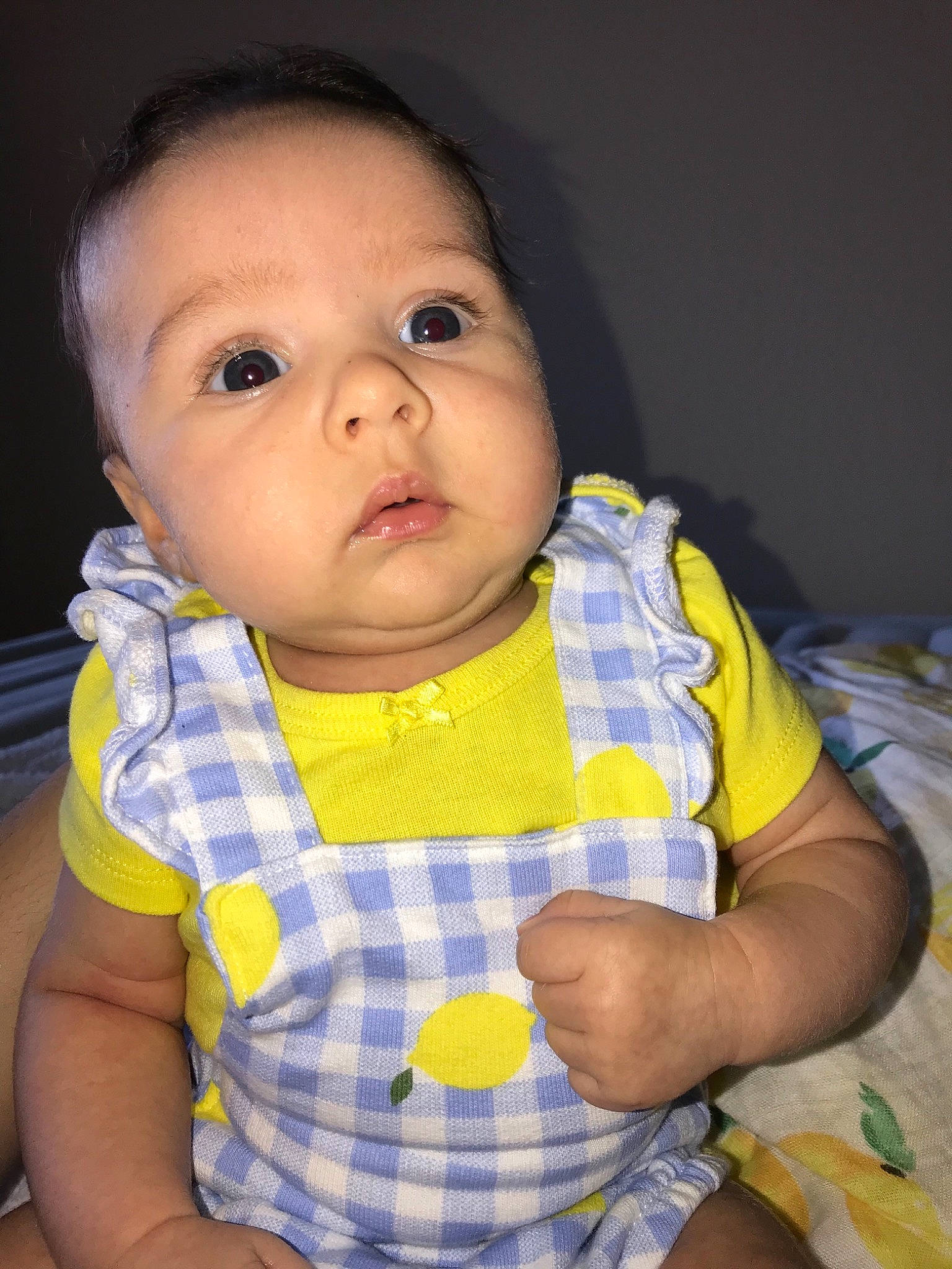 Sofia joined the competition — help win amazing prizes! baby, cheek, child, chin, eye, face, head, iris, lip, mouth, nose, pattern, person, plaid, sitting, skin, smile, toddler, yellow