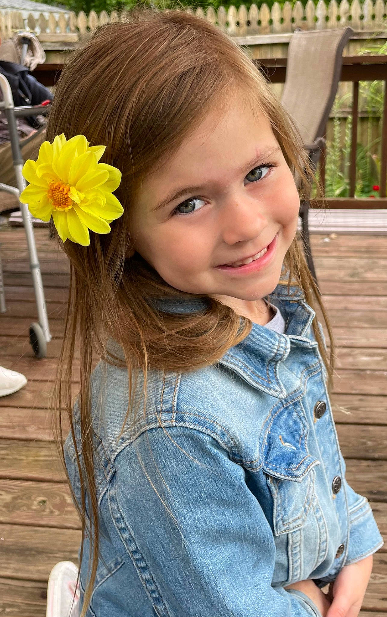 Finnley joined the competition — help win amazing prizes! clothing, cool, denim, facial_expression, fashion, flower, grass, hairstyle, happy, iris, joy, lip, neck, person, petal, plant, shoulder, skin, smile, standing