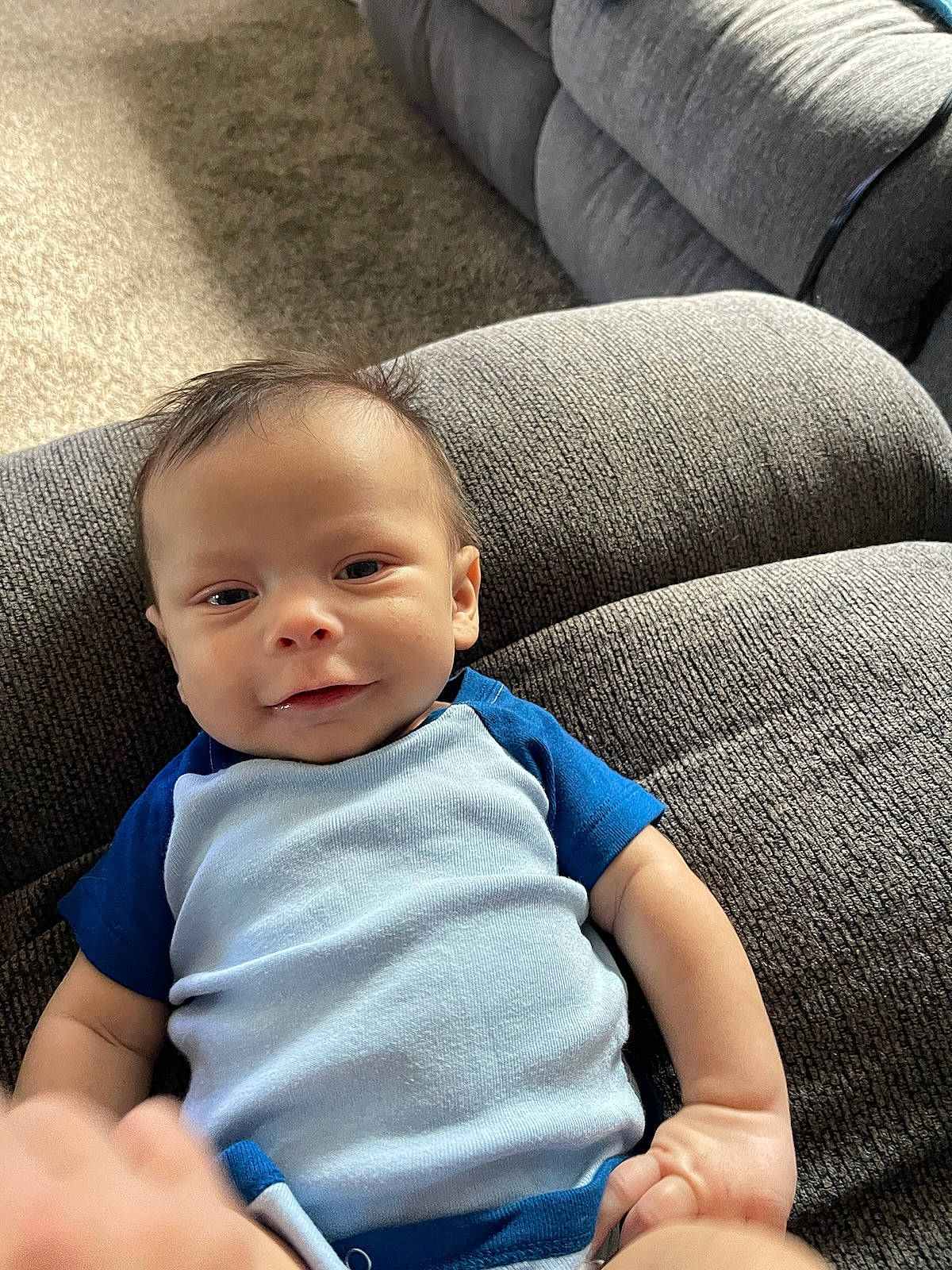 Marcellus joined the competition — help win amazing prizes! auto_part, azure, baby, baby_products, baby_toddler_clothing, blue, car_seat, cheek, child, comfort, electric_blue, finger, human_leg, person, product, sitting, skin, smile, thumb, toddler