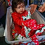baby, basket, bed, bodypart, box, clothing, coat, crib, dress, face, finger, furniture, hand, head, infantbed, laundry, pajamas, person, photography, portrait