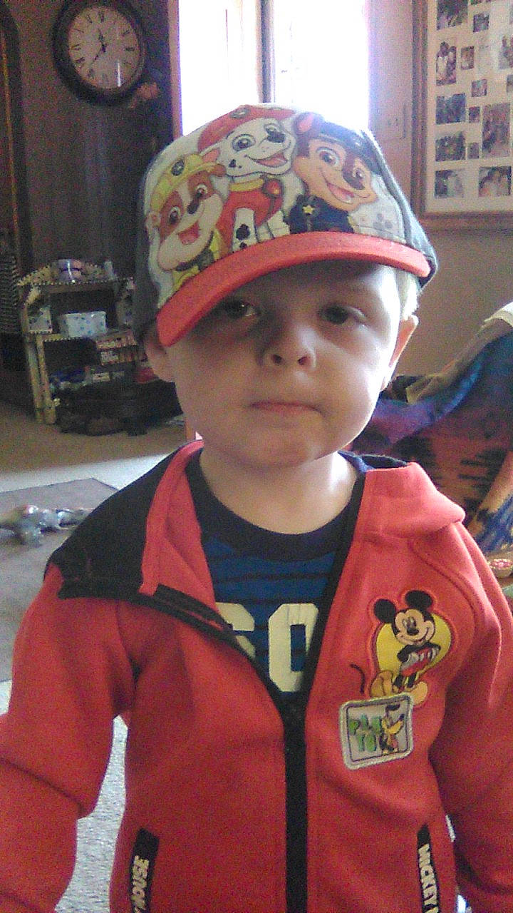 Ashton joined the competition — help win amazing prizes! baby, baseball_cap, cap, carmine, child, cool, face, facial_expression, fashion_accessory, forehead, fun, headgear, headwear, helmet, outerwear, person, personal_protective_equipment, sleeve, sports_gear, t_shirt