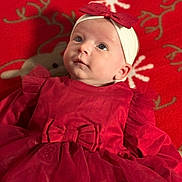 Jade participe au concours pour gagner de l'argent avec cette photo : baby, infant, red_dress, headband, bow, blanket, snowflake_pattern, holiday_theme, reindeer_pattern, cute, child, portrait, face, lying_down, indoors, soft_lighting, festive, tulle, clothing, adorable
