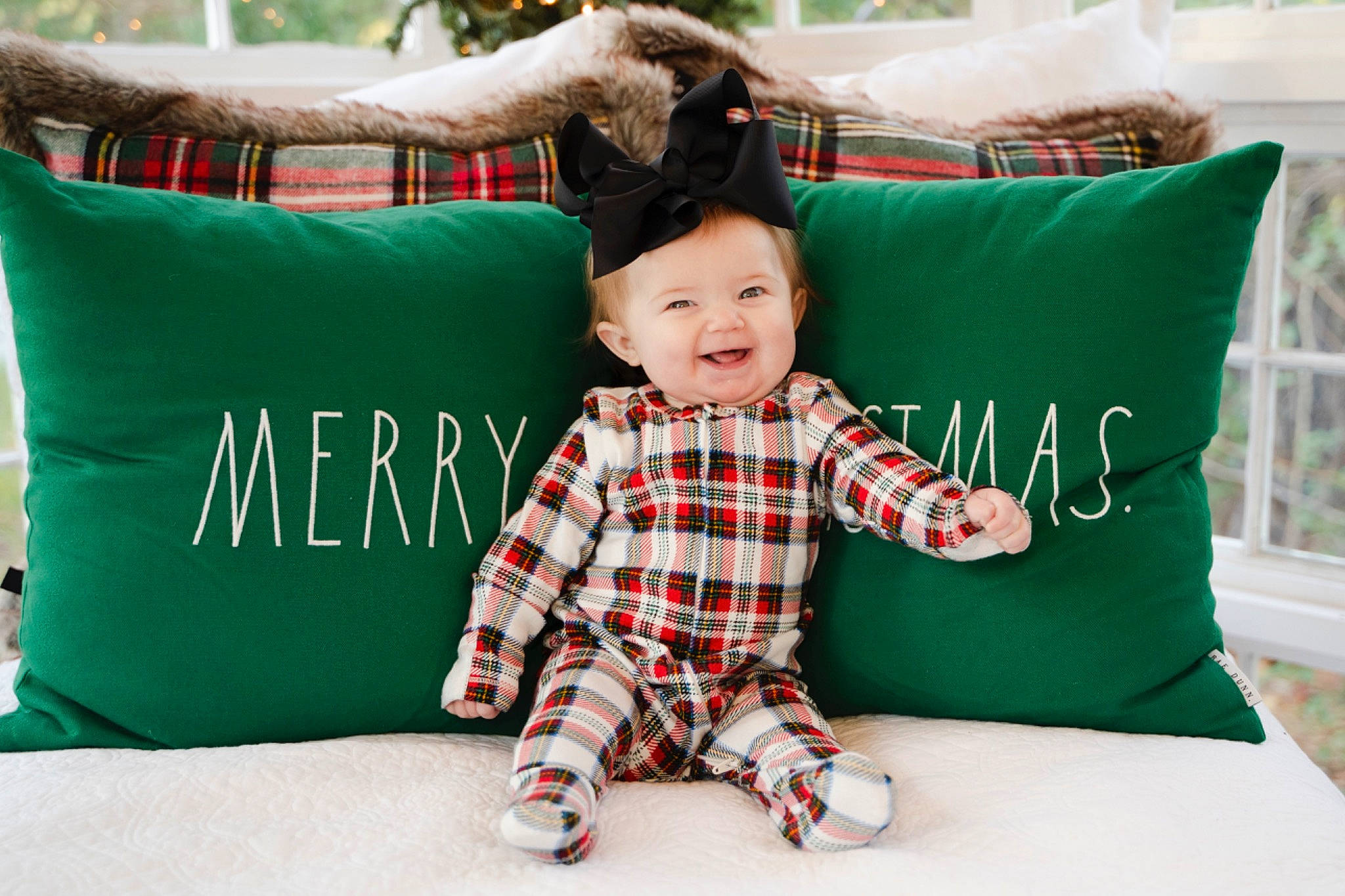 Emmy joined the competition — help win amazing prizes! baby_toddler_clothing, child, comfort, grass, green, happy, joy, leisure, mammal, pattern, person, pillow, plaid, product, rectangle, sleeve, smile, t_shirt, tartan, textile