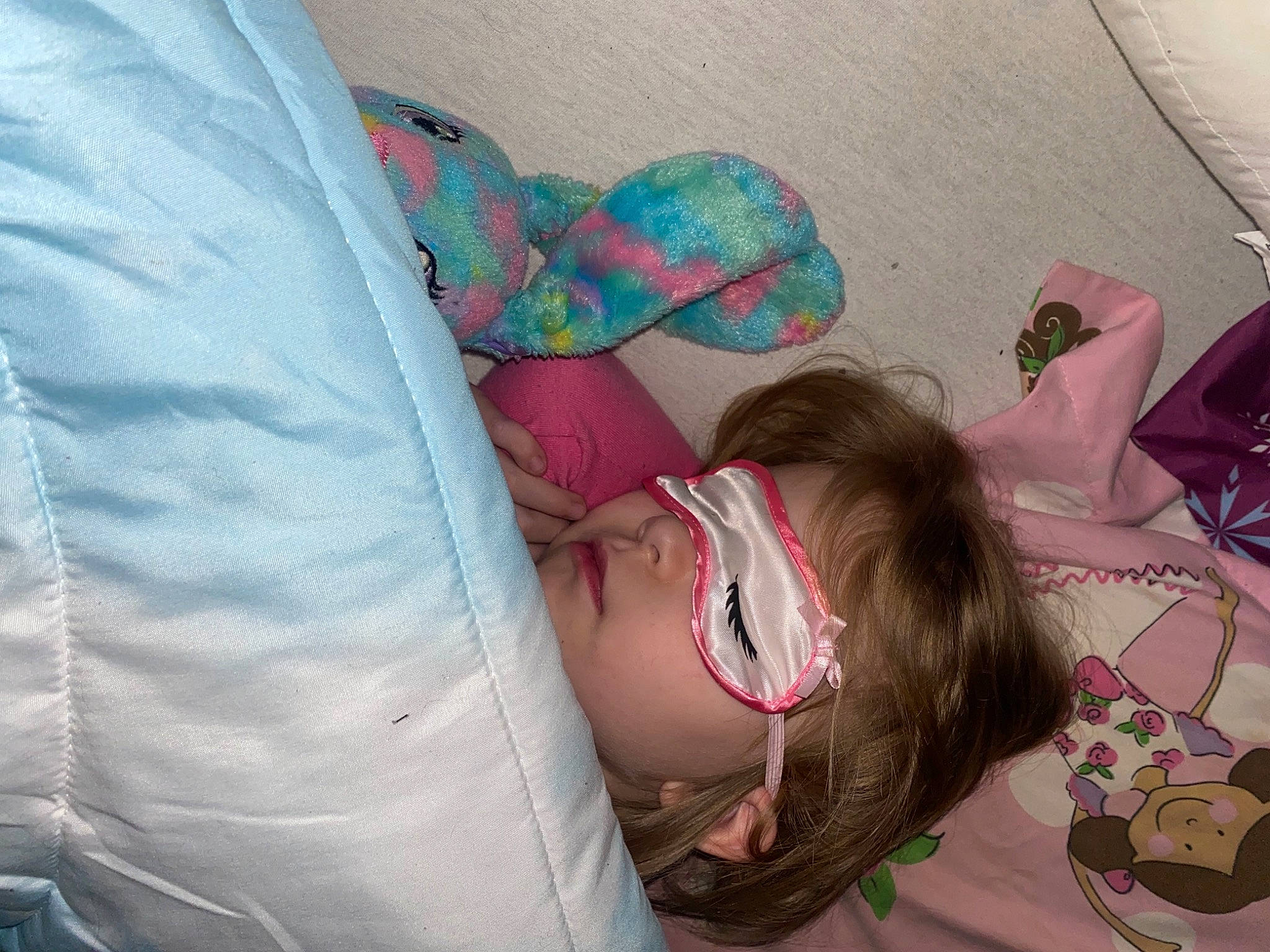 Tinslee is registered to the contest to win money with this photo: baby, child, comfort, fun, glasses, happy, human_body, human_leg, leg, linens, magenta, nap, person, purple, room, sitting, smile, textile, thigh, toddler