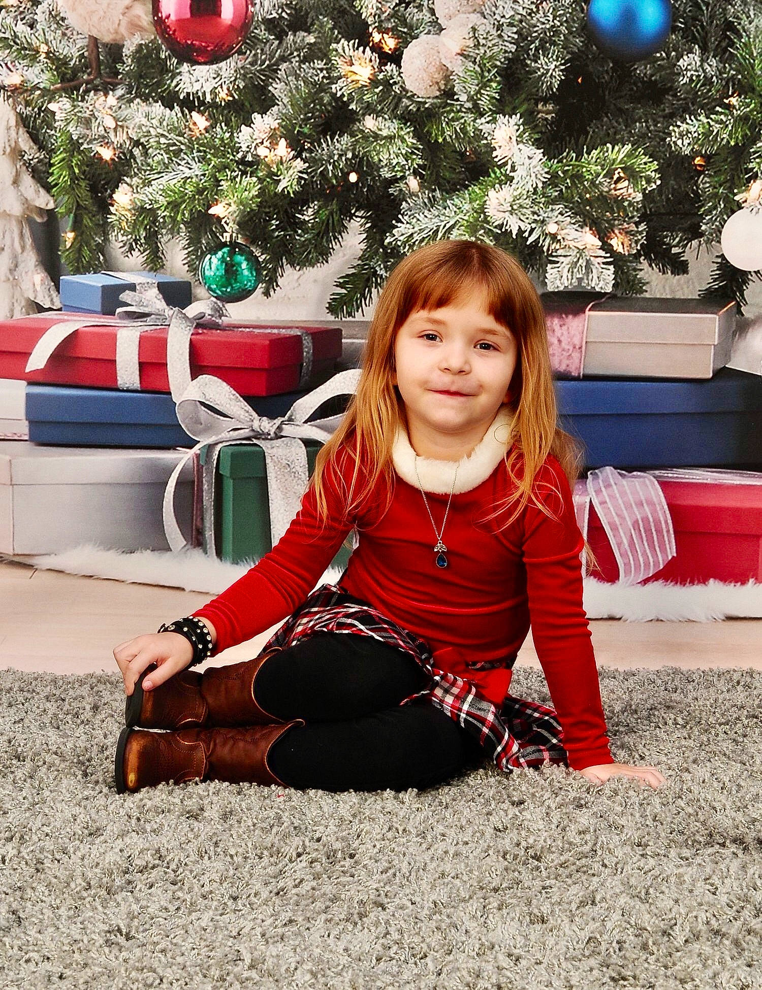 Tinslee Brock is registered to the contest to win money with this photo: baby_toddler_clothing, child, christmas, christmas_decoration, christmas_eve, christmas_ornament, christmas_tree, conifer, face, holiday, holiday_ornament, human, human_body, joy, mouth, nose, ornament, party_supply, person, red