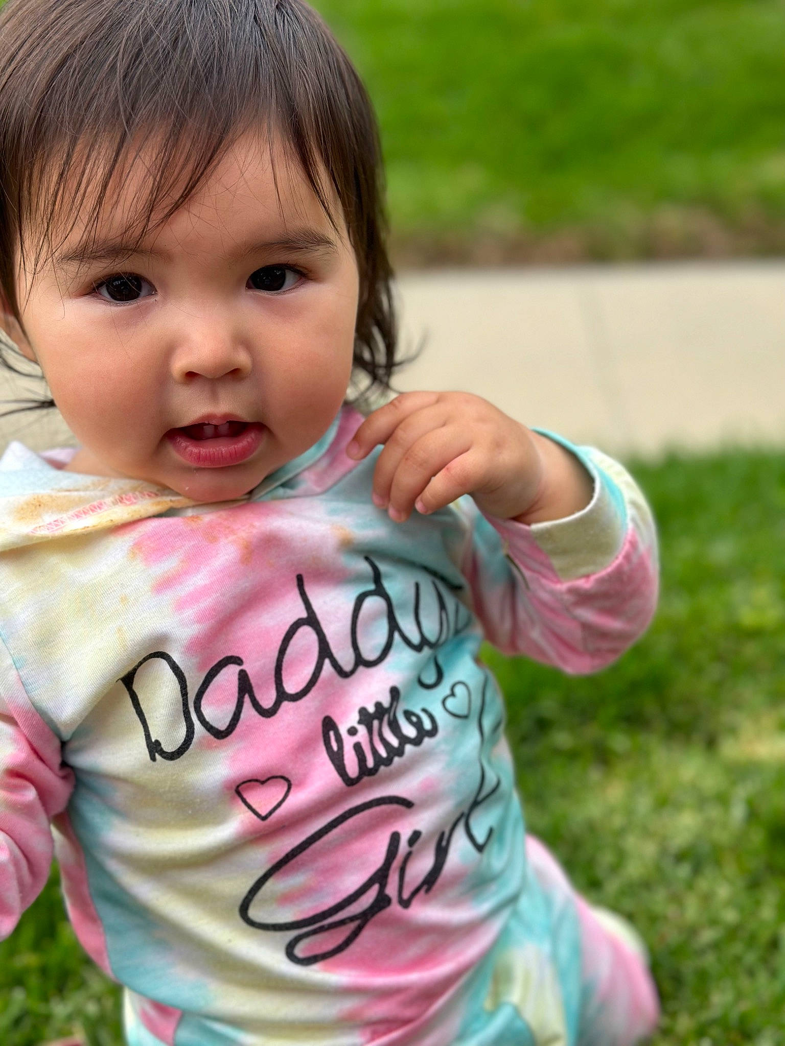 Briana is registered to the contest to win money with this photo: baby, baby_toddler_clothing, cheek, child, eyelash, finger, fun, gesture, grass, happy, leisure, lip, nose, person, pink, play, recreation, sleeve, t_shirt, toddler