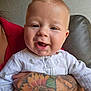 Jerald joined the competition — help win amazing prizes! arm, baby, babylaughing, bodypart, couch, cushion, face, furniture, happy, head, homedecor, laughing, newborn, person, photography, portrait, skin, smile, tattoo