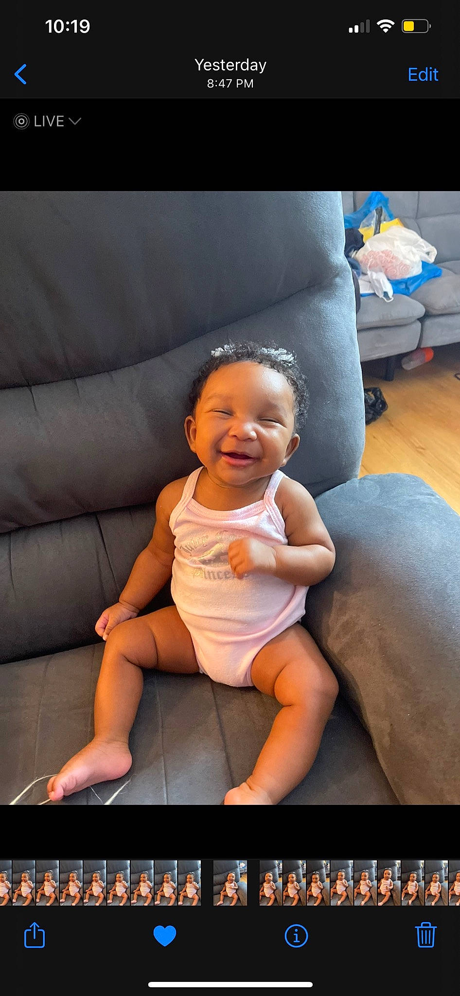 Demi joined the competition — help win amazing prizes! baby, baby_toddler_clothing, barefoot, child, comfort, couch, floor, foot, fun, happy, human_body, human_leg, knee, lap, leg, leisure, person, sitting, smile, thigh