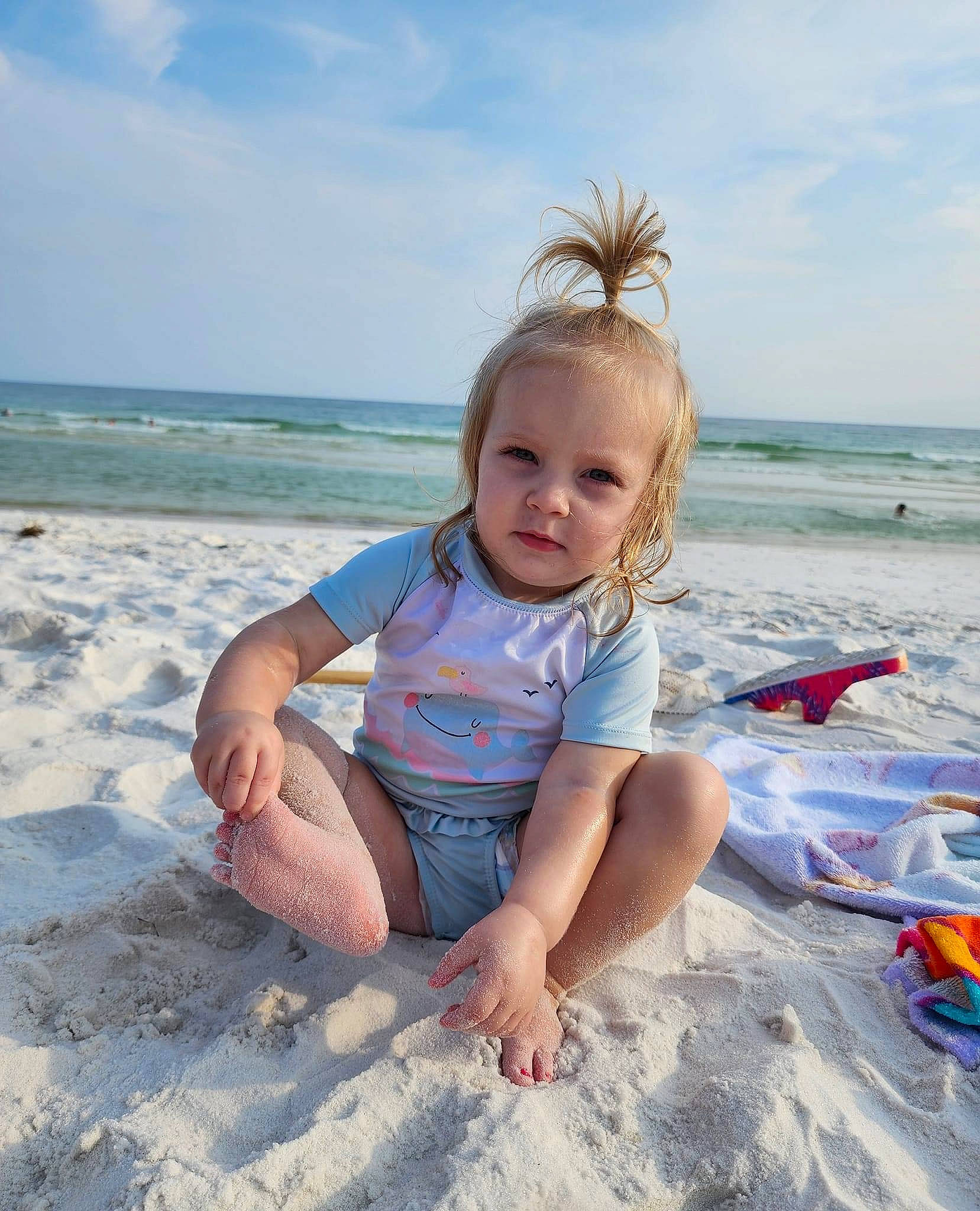 Marleigh is registered to the contest to win money with this photo: barefoot, beach, cloud, electric_blue, foot, fun, happy, holiday, horizon, leisure, people_in_nature, people_on_beach, person, sand, shore, sky, thigh, toddler, travel, water