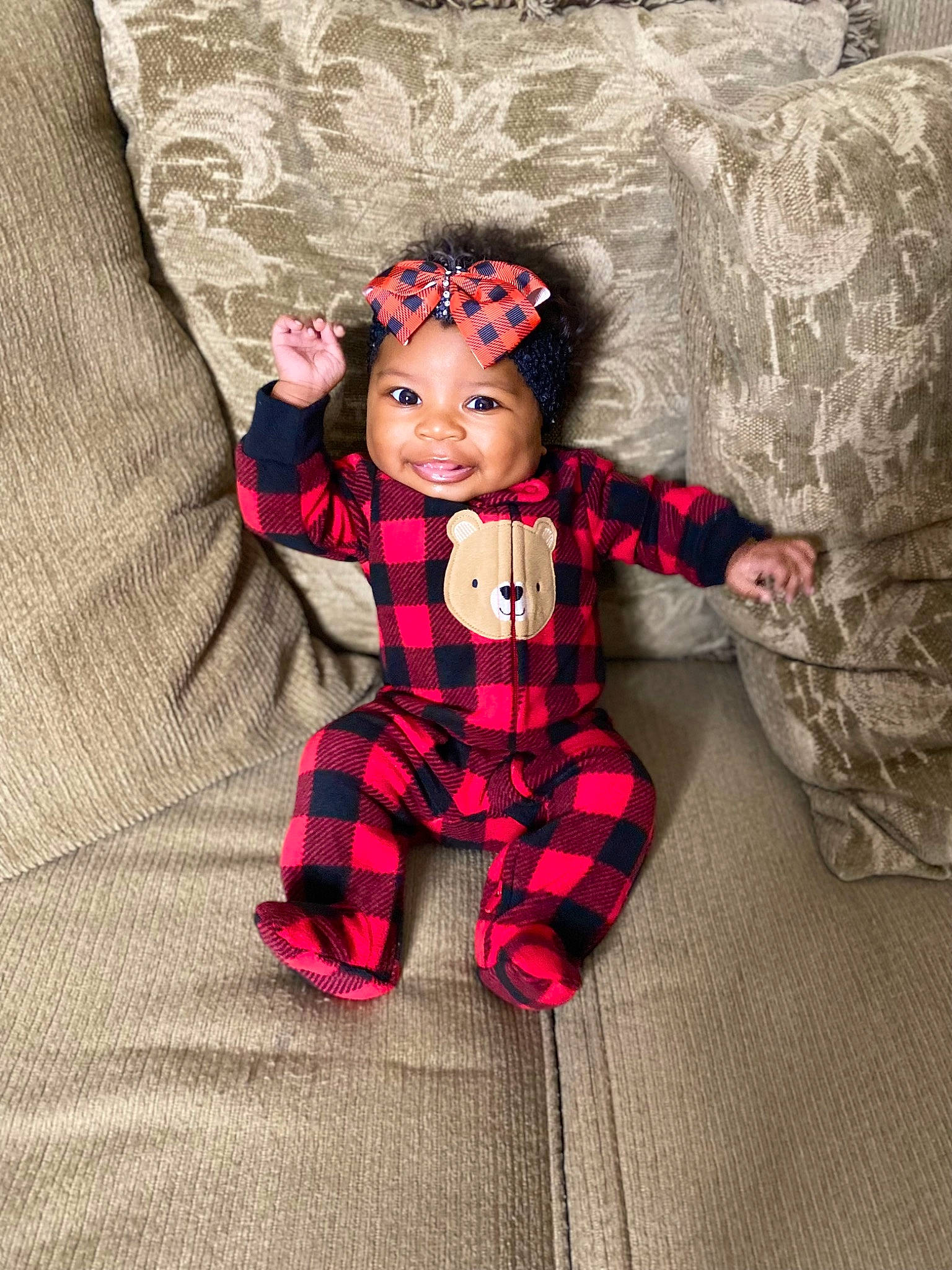 Aubrielle joined the competition — help win amazing prizes! baby, baby_toddler_clothing, doll, eye, face, happy, headgear, headwear, joy, linens, magenta, outerwear, pattern, person, pink, plaid, skin, sleeve, smile, tartan