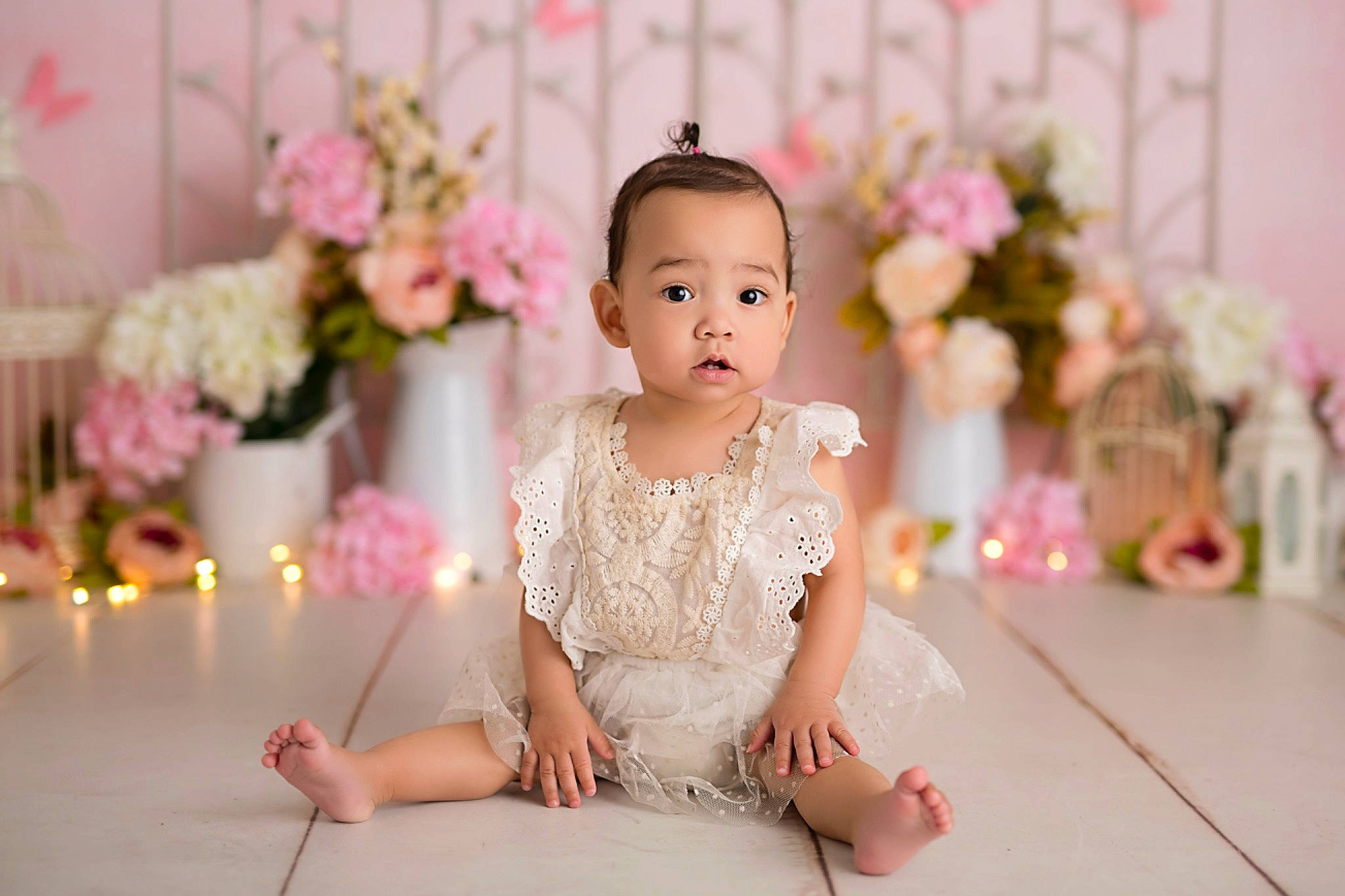 Aviana is registered to the contest to win money with this photo: baby, candle, dress, embellishment, event, facial_expression, flooring, flower, flower_arranging, fun, hand, happy, headpiece, jewellery, magenta, person, petal, pink, skin, toddler