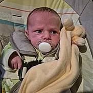 Jake joined the competition — help win amazing prizes! baby, blanket, car_seat, child, clothing, comfort, cute, expression, fabric, face, hand, harness, indoors, infant, newborn, pacifier, person, plush_toy, seat, soft_toy