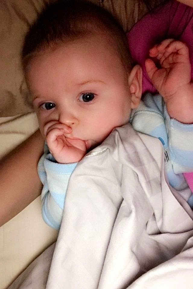 Jessica joined the competition — help win amazing prizes! baby, child, infant, blanket, hand, face, sleepwear, bed, cuddle, comfort, cute, eyes, skin, person, portrait, rest, snuggle, young, indoors, sleep