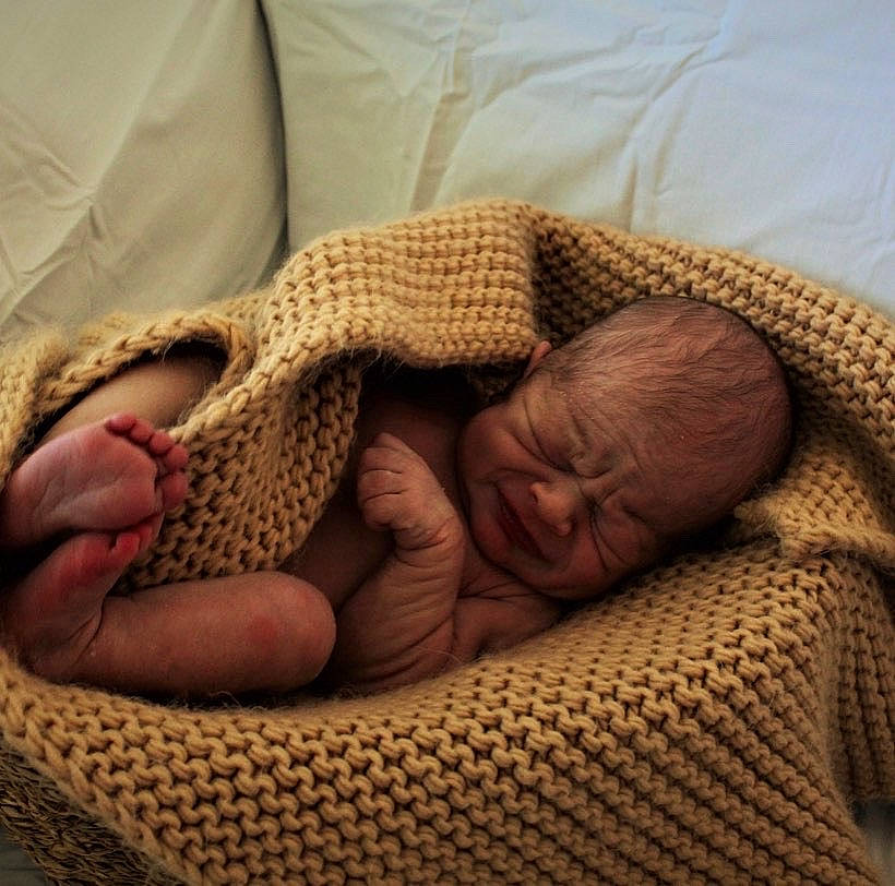 Colter is registered to the contest to win money with this photo: art, baby, baby_sleeping, bedtime, child, close_up, comfort, foot, gesture, hand, human_leg, linens, nail, nap, pattern, person, skin, textile, thumb, toddler