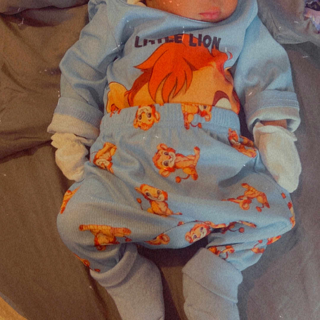 Kemarion joined the competition — help win amazing prizes! baby, bed, blanket, child, clothing, comfort, cozy, cute, fabric, gloves, headwear, indoors, infant, lion_king, pajamas, portrait, resting, sleeping, socks, soft_lighting