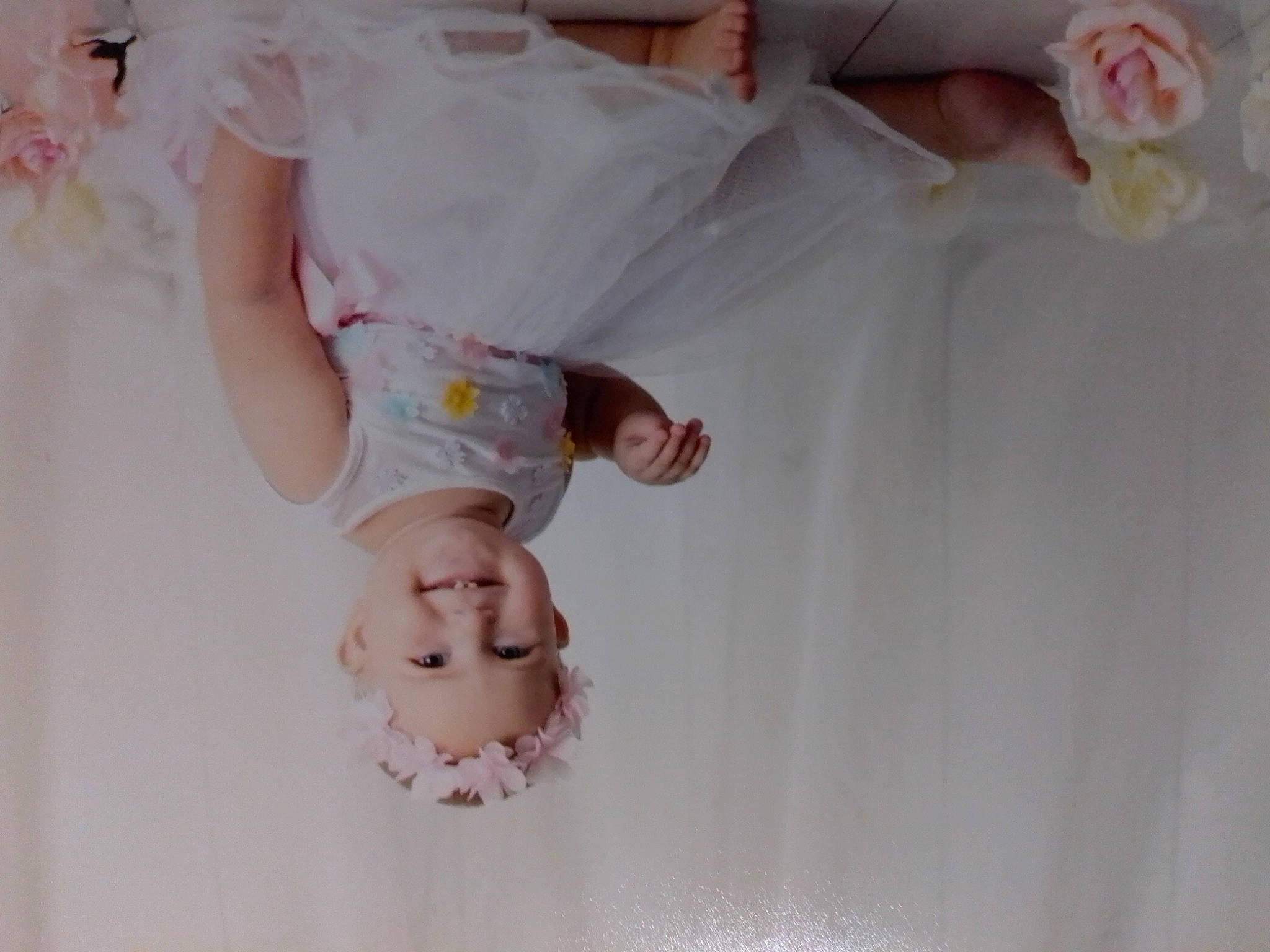 Kylah is registered to the contest to win money with this photo: baby, bridal_accessory, child, dress, finger, gesture, hand, headwear, joy, lace, person, photography, pink, skin, textile, white