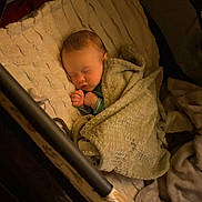 David is registered to the contest to win money with this photo: baby, blanket, sleeping, crib, infant, cozy, soft, child, peaceful, indoors, cute, face, resting, wrapped, comfort, toddler, bed, homedecor, warm, quiet