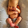 Evangeline is registered to the contest to win money with this photo: baby, child, closeup, cozy, cute, diaper, human, indoors, infant, naked, newborn, peaceful, portrait, resting, skin, sleeping, soft_texture, striped_blanket, tiny_feet, tiny_hands